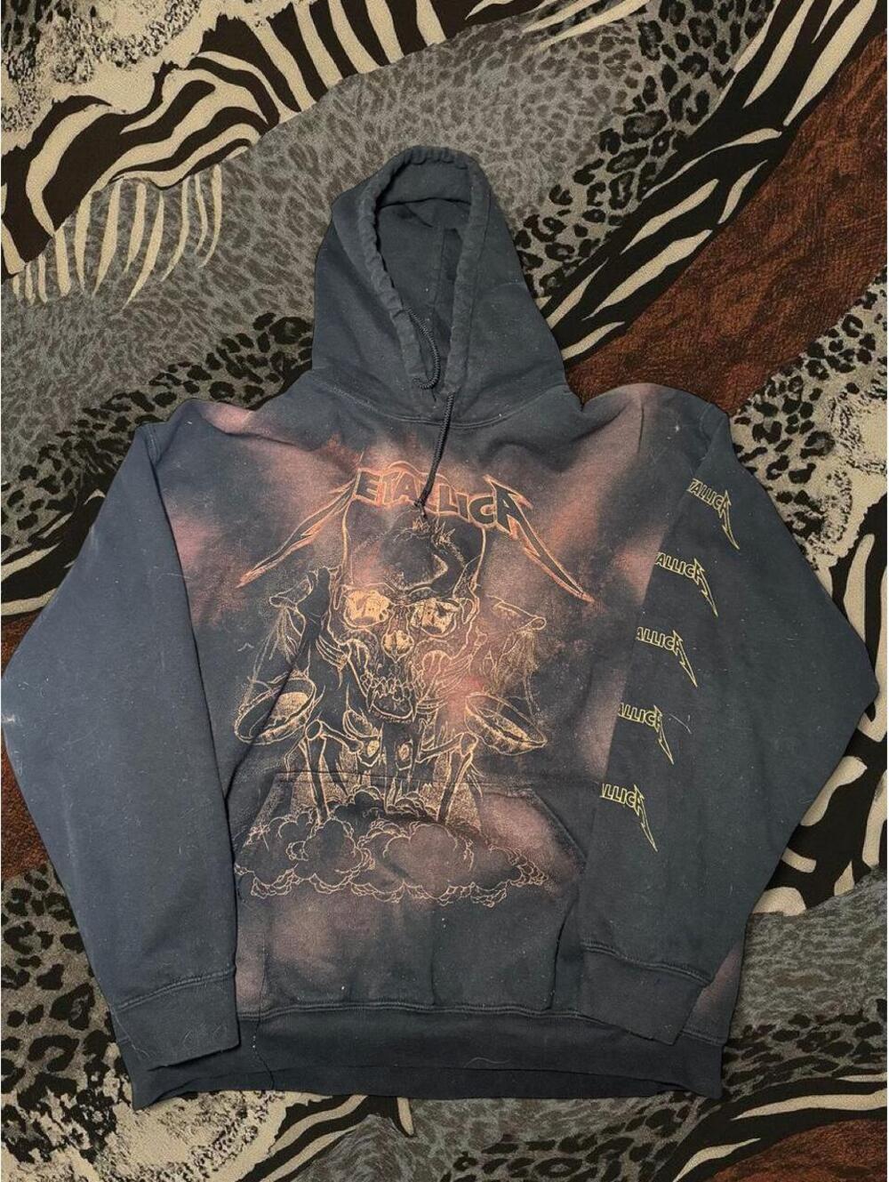 Metallica hoodie with graphic of a skeleton playing drums